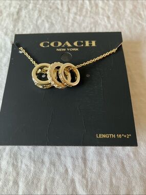 COACH: Gold Interlocking Ring Pendant Necklace